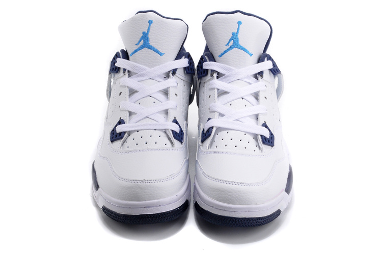 white and dark blue jordans